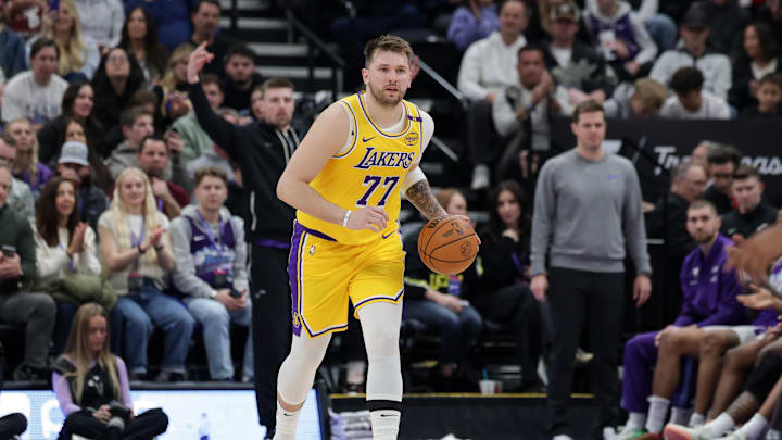 Feb 12, 2025; Salt Lake City, Utah, USA;  Los Angeles Lakers guard Luka Doncic (77) dribbles during the second quarter against the Utah Jazz at Delta Center. Mandatory Credit: Chris Nicoll-Imagn Images