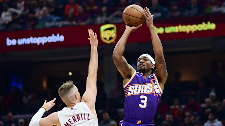 Mar 11, 2024; Cleveland, Ohio, USA; Phoenix Suns guard Bradley Beal (3) shoots over the defense of Cleveland Cavaliers guard Sam Merrill (5) during the first half at Rocket Mortgage FieldHouse. Mandatory Credit: Ken Blaze-Imagn Images