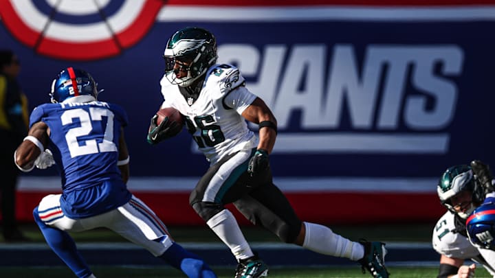 Oct 20, 2024; East Rutherford, New Jersey, USA; Philadelphia Eagles running back Saquon Barkley (26) carries the ball as New York Giants safety Jason Pinnock (27) pursues during the second half at MetLife Stadium. Mandatory Credit: Vincent Carchietta-Imagn Images