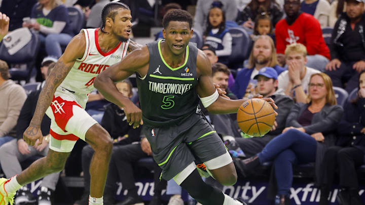 Nov 26, 2024; Minneapolis, Minnesota, USA; Minnesota Timberwolves guard Anthony Edwards (5) drives past Houston Rockets guard Jalen Green (4) in the third quarter at Target Center. Mandatory Credit: Bruce Kluckhohn-Imagn Images