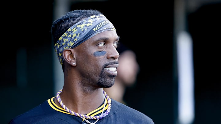 Jun 19, 2025; Detroit, Michigan, USA;  Pittsburgh Pirates designated hitter Andrew McCutchen (22) in the dugout in the sixth inning against the Detroit Tigers at Comerica Park. Mandatory Credit: Rick Osentoski-Imagn Images