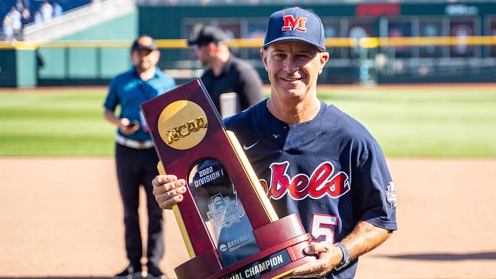 Ole Miss Rebels head coach Mike Bianco holds 2022 NCAA Division 1 Baseball National Champion trophy after defeating the Oklahoma Sooners at Charles Schwab Field. Ole Miss Rebels head coach Mike Bianco holds 2022 NCAA Division 1 Baseball National Champion trophy after defeating the Oklahoma Sooners at Charles Schwab Field.