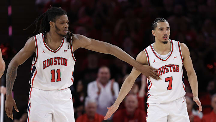 Mar 4, 2026; Houston, Texas, USA;  Houston Cougars forward Joseph Tugler (11) reacts to  guard Milos Uzan (7) play agains the Baylor Bears n the  first half at Fertitta Center. Mandatory Credit: Thomas Shea-Imagn Images