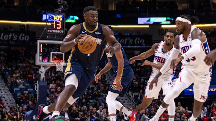 Nov 29, 2023; New Orleans, Louisiana, USA; New Orleans Pelicans forward Zion Williamson (1) dribbles against Philadelphia 76ers forward Robert Covington (33) during  the second half at the Smoothie King Center. Mandatory Credit: Stephen Lew-Imagn Images