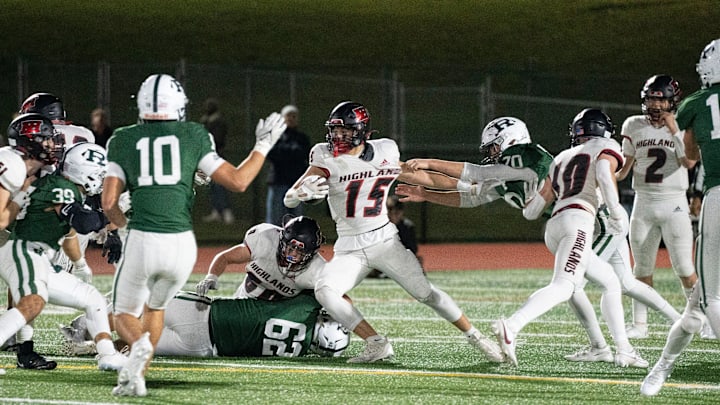 Nov 10, 2023; Franklin Lakes, NJ, USA; Northern Highlands at Ramapo in the NJSIAA North 1, Group 4 sectional final. NH #15 Chase Calarco tries to avoid a tackle in the first quarter.
