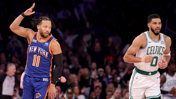 Feb 24, 2024; New York, New York, USA; New York Knicks guard Jalen Brunson (11) celebrates his three point shot against Boston Celtics forward Jayson Tatum (0) during the first quarter at Madison Square Garden. Mandatory Credit: Brad Penner-Imagn Images