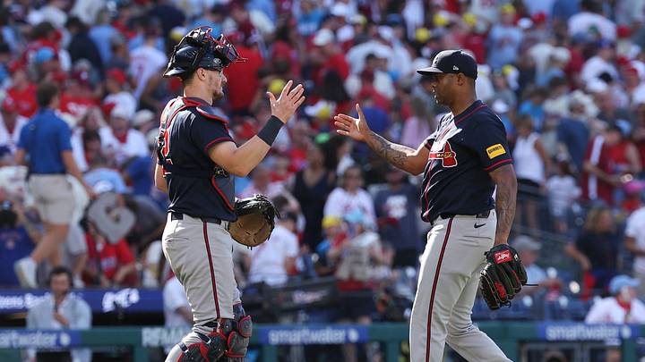 Sep 6, 2026; Philadelphia, Pennsylvania, USA; Atlanta Braves pitcher Raisel Iglesias (26) pitcher Raisel Iglesias (26) shake hands after a victory against the Philadelphia Phillies at Citizens Bank Park. Mandatory Credit: Bill Streicher-Imagn Images