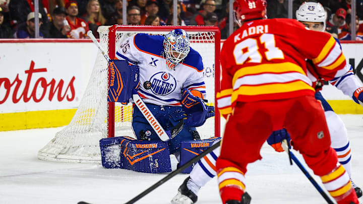 Feb 4, 2026; Calgary, Alberta, CAN; Edmonton Oilers goaltender Tristan Jarry (35) makes a save against the Calgary Flames during the second period at Scotiabank Saddledome. Mandatory Credit: Sergei Belski-Imagn Images