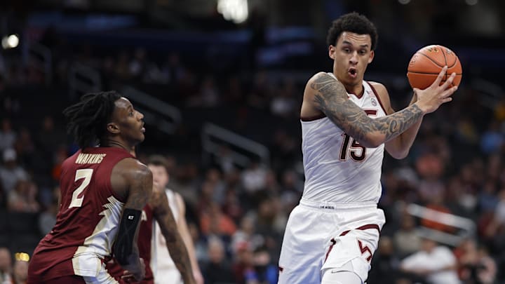 Mar 13, 2024; Washington, D.C., USA; Virginia Tech Hokies center Lynn Kidd (15) drives to the basket as Florida State Seminoles forward Jamir Watkins (2) defends in the first half at Capital One Arena. Mandatory Credit: Geoff Burke-USA TODAY Sports