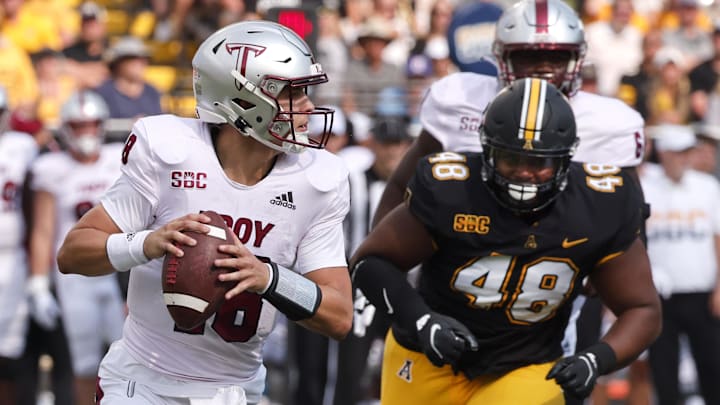 Sep 17, 2022; Boone, North Carolina, USA; Appalachian State Mountaineers defensive lineman Deshawn McKnight (48) chases Troy Trojans quarterback Gunnar Watson (18) during the first quarter at Kidd Brewer Stadium. Mandatory Credit: Reinhold Matay-Imagn Images