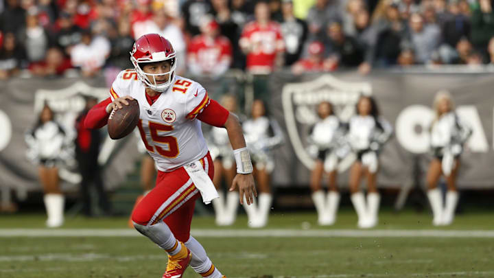Dec 2, 2018; Oakland, CA, USA; Kansas City Chiefs quarterback Patrick Mahomes (15) runs the ball against the Oakland Raiders in the third quarter at Oakland Coliseum. Mandatory Credit: Cary Edmondson-Imagn Images