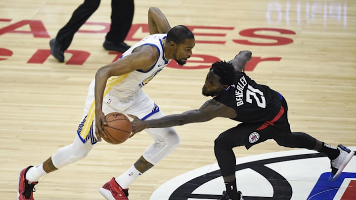 Apr 18, 2019; Los Angeles, CA, USA; Golden State Warriors forward Kevin Durant (35) moves the ball while Los Angeles Clippers guard Patrick Beverley (21) defends during the first half in game three of the first round of the 2019 NBA Playoffs at Staples Center. Mandatory Credit: Kelvin Kuo-Imagn Images