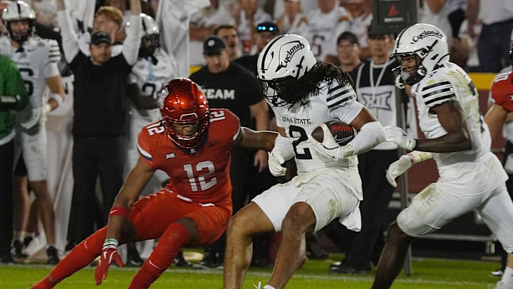 Iowa State Cyclones' defensive back Jamison Patton (2) runs with the ball after an interception around Arizona Wildcats defensive back Genesis Smith (12) during the fourth quarter in the Big-12 conference showdown on Sept. 27, 2025, at Jack Trice Stadium in Ames, Iowa.