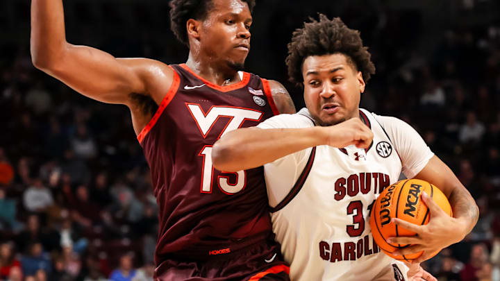 Dec 2, 2025; Columbia, S.C.; South Carolina forward Elijah Strong (31) drives around Virginia Tech forward Amani Hansberry (13).
