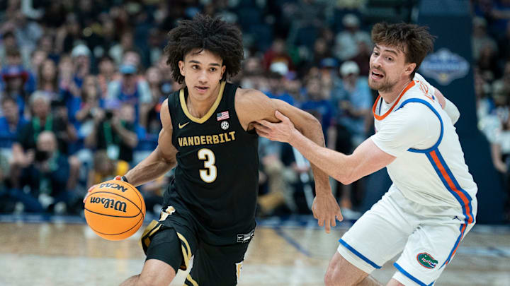 Vanderbilt guard Tyler Tanner (3) drives against Florida guard Urban Klavzar (7) during their semifinal game of the 2026 SEC Men’s Basketball Tournament at Bridgestone Arena in Nashville, Tenn., Saturday, March 14, 2026.