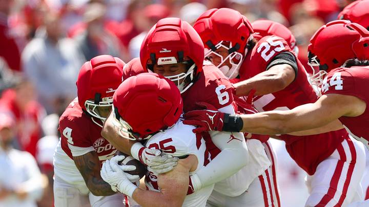 Oklahoma Sooners defensive back Courtland Guillory (4) and defensive lineman Nigel Smith II (6) tackle running back Andy Bass (25). Oklahoma Sooners defensive back Courtland Guillory (4) and defensive lineman Nigel Smith II (6) tackle running back Andy Bass (25).