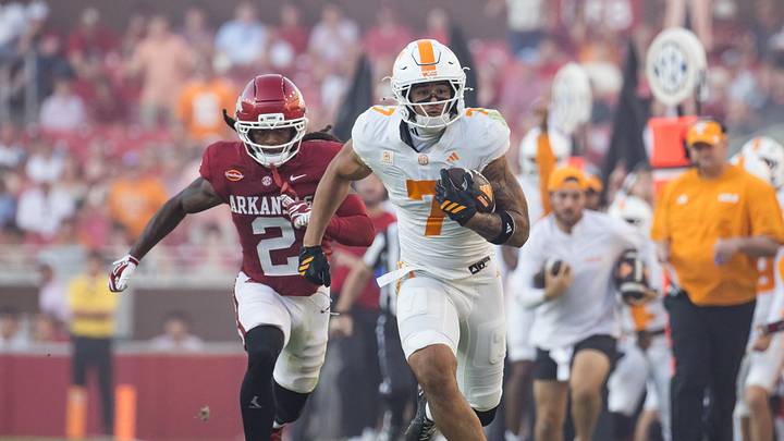 Oct 10, 2026; Fayetteville, Arkansas, USA;  Arkansas Razorbacks defensive back Shelton Lewis (2) closes in on Tennessee Volunteers tight end Dasaahn Brame (7) during the fourth quarter at Donald W. Reynolds Razorback Stadium.  Mandatory Credit: Brett Rojo-Imagn Images