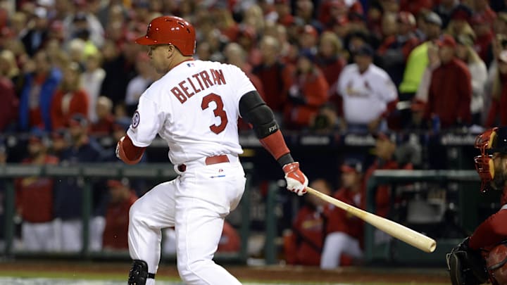 Oct 27, 2013; St. Louis, MO, USA; St. Louis Cardinals right fielder Carlos Beltran (3) hits a RBI single against the Boston Red Sox in the third inning during game four of the MLB baseball World Series at Busch Stadium. Mandatory Credit: H.Darr Beiser-Imagn Images