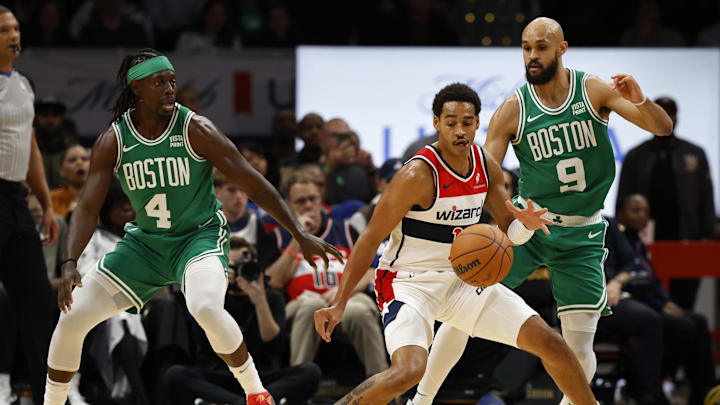 Oct 30, 2023; Washington, District of Columbia, USA; Washington Wizards guard Jordan Poole (13) is guarded by the Boston Celtics' backcourt of Derrick White and Jrue Holiday. Oct 30, 2023; Washington, District of Columbia, USA; Washington Wizards guard Jordan Poole (13) is guarded by the Boston Celtics' backcourt of Derrick White and Jrue Holiday.