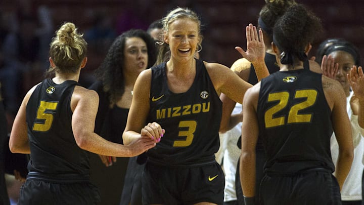 Mar 8, 2019; Greenville, SC, USA; Missouri Tigers guard Sophie Cunningham (3) celebrates with teammates Lauren Aldridge (5) and Jordan Roundtree (22) during the first half of game eight against the Kentucky Wildcats in the women's SEC Conference Tournament at Bon Secours Wellness Arena. Mandatory Credit: Joshua S. Kelly-Imagn Images