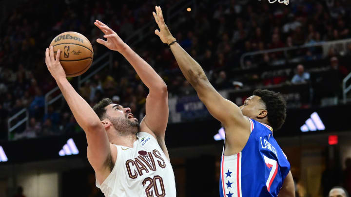 Mar 29, 2024; Cleveland, Ohio, USA; Cleveland Cavaliers forward Georges Niang (20) shoots over the defense of Philadelphia 76ers guard Kyle Lowry (7) during the second half at Rocket Mortgage FieldHouse.