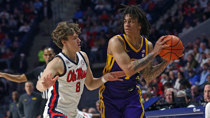 Jan 11, 2025; Oxford, Mississippi, USA; LSU Tigers guard Dji Bailey (4) handles the ball as Mississippi Rebels guard Eduardo Klafke (8) defends during the first half at The Sandy and John Black Pavilion at Ole Miss. Mandatory Credit: Petre Thomas-Imagn Images Jan 11, 2025; Oxford, Mississippi, USA; LSU Tigers guard Dji Bailey (4) handles the ball as Mississippi Rebels guard Eduardo Klafke (8) defends during the first half at The Sandy and John Black Pavilion at Ole Miss. Mandatory Credit: Petre Thomas-Imagn Images