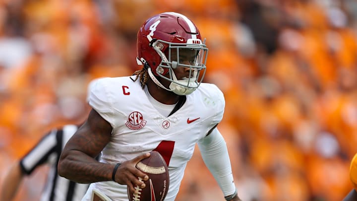 Oct 19, 2024; Knoxville, Tennessee, USA; Alabama Crimson Tide quarterback Jalen Milroe (4) scrambles against the Tennessee Volunteers during the second quarter at Neyland Stadium. Mandatory Credit: Randy Sartin-Imagn Images