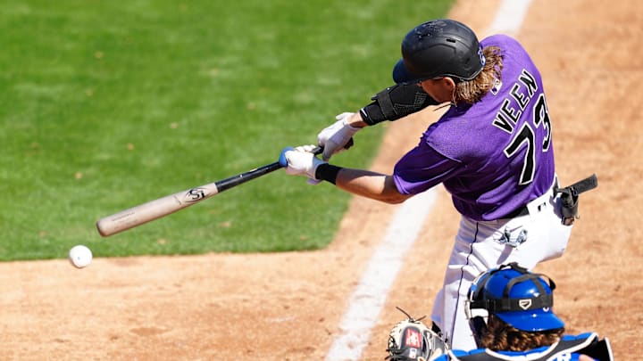 Mar 18, 2023; Las Vegas, Nevada, USA; Colorado Rockies right fielder Zac Veen (73) connects against the Kansas City Royals during the seventh inning at Las Vegas Ballpark. Mar 18, 2023; Las Vegas, Nevada, USA; Colorado Rockies right fielder Zac Veen (73) connects against the Kansas City Royals during the seventh inning at Las Vegas Ballpark.