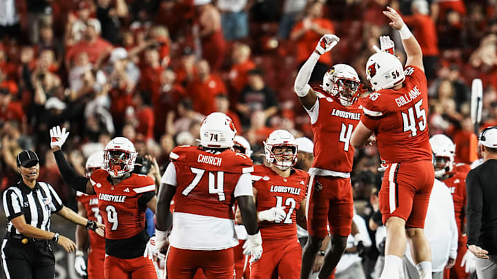 Louisville Cardinals defensive back Jabari Mack (4), left, celebrates with Louisville Cardinals offensive lineman Carter Guillaume (56) after Mack had an interception late in the fourth quarter as the Cards defeated the James Madison University Dukes 28-14 Friday September 5, 2025 at L&N Federal Credit Union Stadium in Louisville, Kentucky. Louisville Cardinals defensive back Jabari Mack (4), left, celebrates with Louisville Cardinals offensive lineman Carter Guillaume (56) after Mack had an interception late in the fourth quarter as the Cards defeated the James Madison University Dukes 28-14 Friday September 5, 2025 at L&N Federal Credit Union Stadium in Louisville, Kentucky.