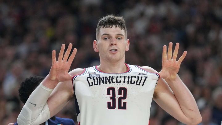 Apr 8, 2024; Glendale, AZ, USA; Connecticut Huskies center Donovan Clingan (32) celebrates defeating the Purdue Boilermakers in the national championship game of the Final Four of the 2024 NCAA Tournament at State Farm Stadium. Mandatory Credit: Robert Deutsch-USA TODAY Sports