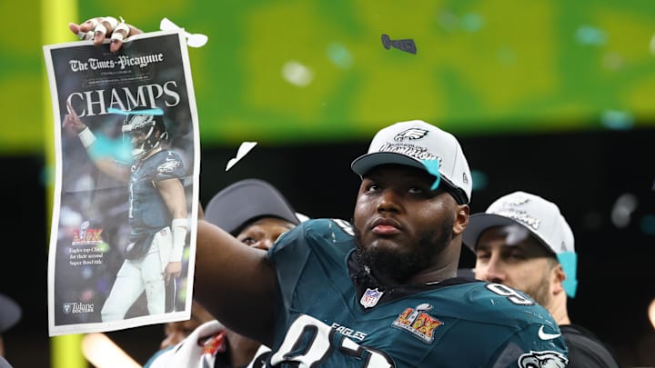 Feb 9, 2025; New Orleans, LA, USA;  Philadelphia Eagles defensive tackle Milton Williams (93) celebrates on the podium after defeating the Kansas City Chiefs in Super Bowl LIX at Ceasars Superdome. Mandatory Credit: Mark J. Rebilas-Imagn Images