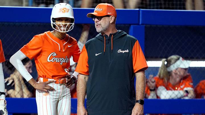 Oklahoma State coach Kenny Gajewski talks with outfielder Kaya Booker. Oklahoma State coach Kenny Gajewski talks with outfielder Kaya Booker.
