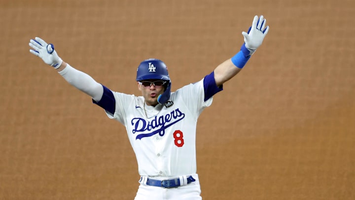 Oct 25, 2024; Los Angeles, California, USA; Los Angeles Dodgers outfielder Enrique Hernandez (8) celebrates at third base after hitting a triple in the fifth inning against the New York Yankees during game one of the 2024 MLB World Series at Dodger Stadium. Mandatory Credit: Kiyoshi Mio-Imagn Images
