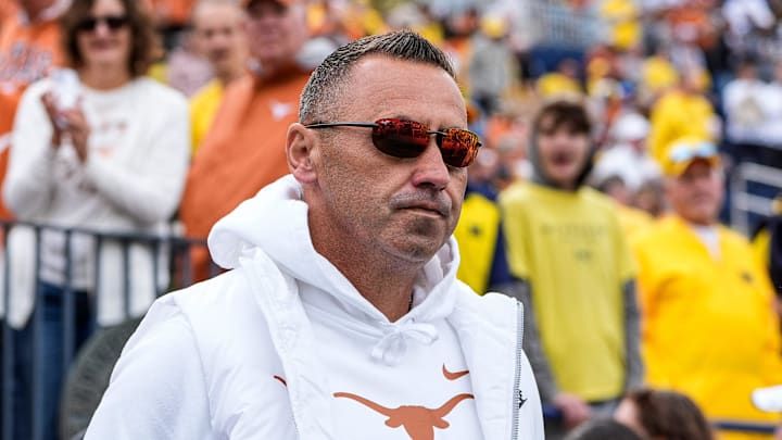 Texas head coach Steve Sarkisian takes the field for warm up at Michigan Stadium in Ann Arbor on Saturday, Sept. 7, 2024.