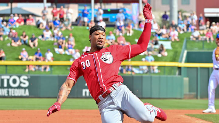Feb 27, 2024; Mesa, Arizona, USA;  Cincinnati Reds right fielder Will Benson (30) triples in the