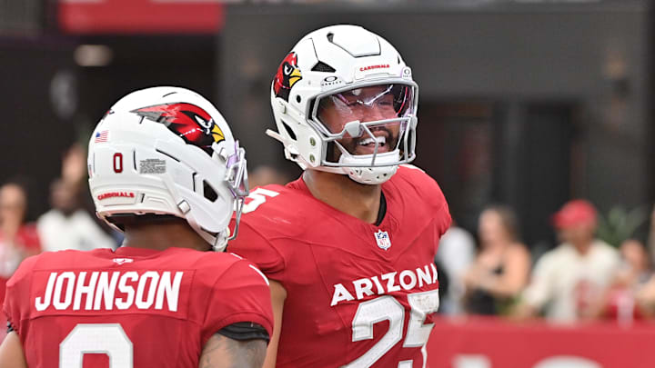 Sep 14, 2025; Glendale, Arizona, USA;  Arizona Cardinals linebacker Zaven Collins (25) celebrates a recovery during the first quarter against the Carolina Panthers at State Farm Stadium. Mandatory Credit: Matt Kartozian-Imagn Images