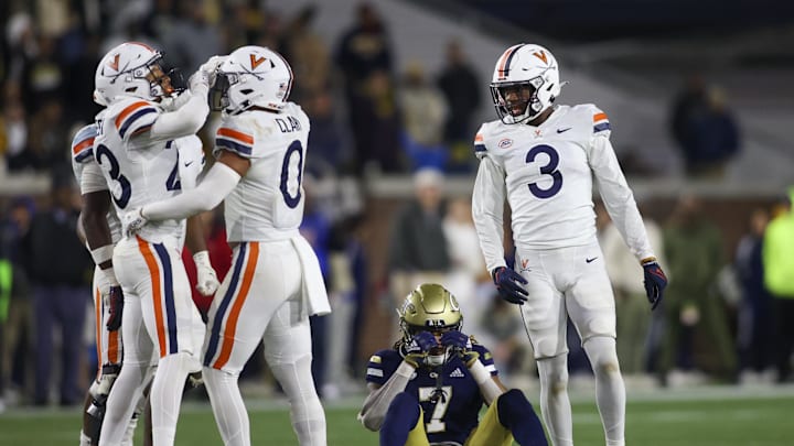 Oct 20, 2022; Atlanta, Georgia, USA; Georgia Tech Yellow Jackets wide receiver Malachi Carter (7) reacts after an incompletion as Virginia Cavaliers defensive back Fentrell Cypress II (23) and Antonio Clary (0) and cornerback Anthony Johnson (3) celebrate in the second half at Bobby Dodd Stadium. Mandatory Credit: Brett Davis-Imagn Images