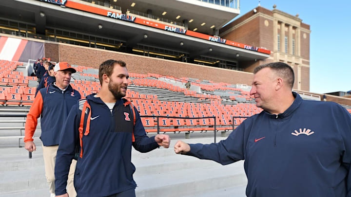 Nov 1, 2025; Champaign, Illinois, USA; Illinois Fighting Illini head coach Bret Bielema greets players and parents before an NCAA game against the Rutgers Scarlet Knights at Memorial Stadium. Mandatory Credit: Ron Johnson-Imagn Images
