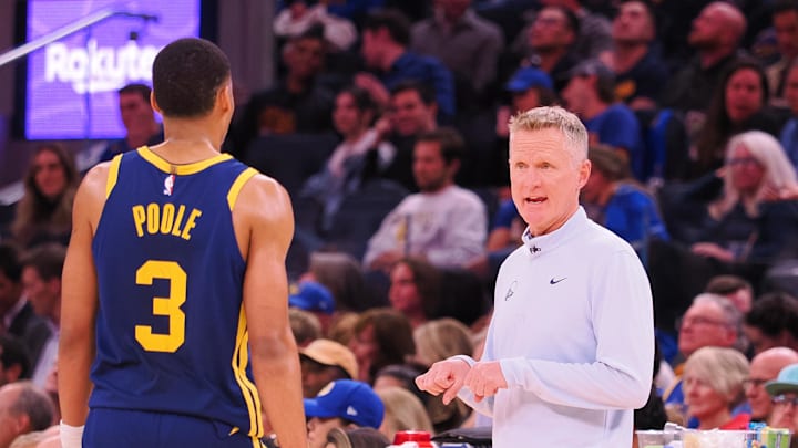 Dec 2, 2022; San Francisco, California, USA; Golden State Warriors head coach Steve Kerr speaks with shooting guard Jordan Poole (3) between plays against the Chicago Bulls during the fourth quarter at Chase Center. Mandatory Credit: Kelley L Cox-Imagn Images