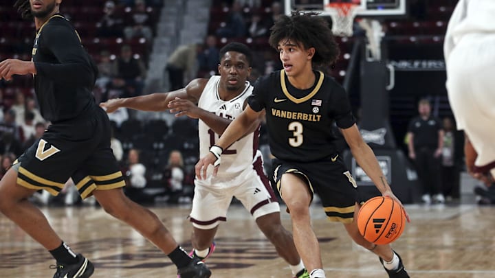 Jan 24, 2026; Starkville, Mississippi, USA; Vanderbilt Commodores guard Tyler Tanner (3) drives to the basket as Mississippi State Bulldogs guard Josh Hubbard (12) defends during the first half at Humphrey Coliseum. Mandatory Credit: Petre Thomas-Imagn Images