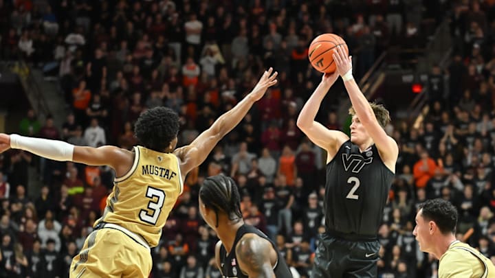 Jan 27, 2026; Blacksburg, Va.; Virginia Tech guard Jaden Schutt (2) shoots a shot as Georgia Tech guard Jaeden Mustaf (3) defends.