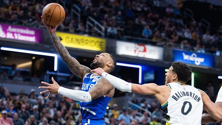 Mar 11, 2025; Indianapolis, Indiana, USA; Milwaukee Bucks guard Damian Lillard (0) shoots the ball while Indiana Pacers guard Tyrese Haliburton (0) defends in the second half at Gainbridge Fieldhouse. Mandatory Credit: Trevor Ruszkowski-Imagn Images Mar 11, 2025; Indianapolis, Indiana, USA; Milwaukee Bucks guard Damian Lillard (0) shoots the ball while Indiana Pacers guard Tyrese Haliburton (0) defends in the second half at Gainbridge Fieldhouse. Mandatory Credit: Trevor Ruszkowski-Imagn Images