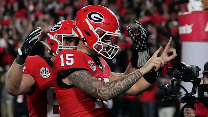 Georgia quarterback Carson Beck (15) celebrates with his teammates after scoring touchdown during the second half of a NCAA college football game against Tennessee in Athens, Ga., on Saturday, Nov. 16, 2024.