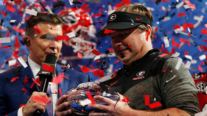 Georgia coach Kirby Smart is presented with the Chick-fil-A Peach Bowl trophy after winning the Chick-fil-A Peach Bowl NCAA College Football Playoff semifinal game between Ohio State and Georgia on Sunday, Jan 1, 2022, in Atlanta. Georgia won 42-41.

News Joshua L Jones