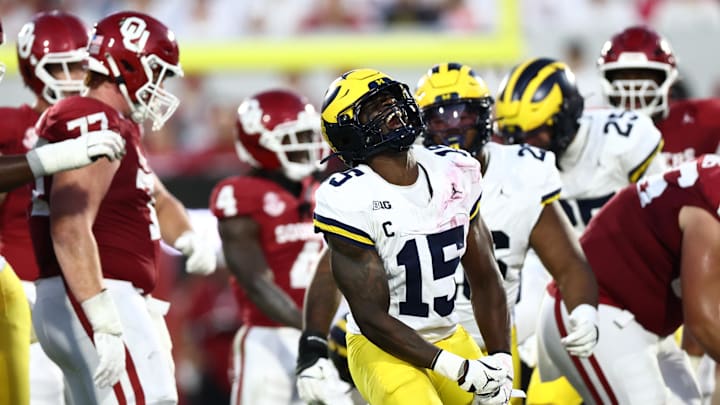 Sep 6, 2025; Norman, Oklahoma, USA; Michigan Wolverines linebacker Ernest Hausmann (15) reacts after a tackle against the Oklahoma Sooners during the first half at Gaylord Family-Oklahoma Memorial Stadium. Mandatory Credit: Kevin Jairaj-Imagn Images Sep 6, 2025; Norman, Oklahoma, USA; Michigan Wolverines linebacker Ernest Hausmann (15) reacts after a tackle against the Oklahoma Sooners during the first half at Gaylord Family-Oklahoma Memorial Stadium. Mandatory Credit: Kevin Jairaj-Imagn Images