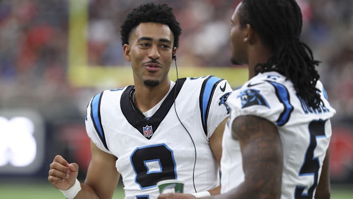 Aug 16, 2025; Houston, Texas, USA; Carolina Panthers quarterback Bryce Young (9) talks on the sideline during the fourth quarter against the Houston Texans at NRG Stadium. 