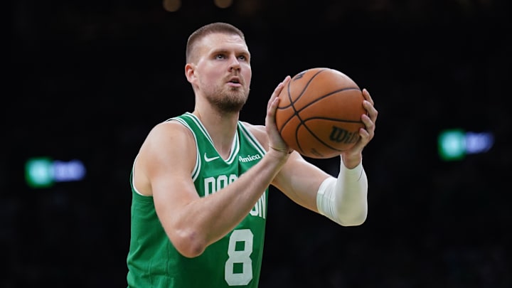 May 7, 2025; Boston, Massachusetts, USA; Boston Celtics center Kristaps Porzingis (8) shoots a free throw against the New York Knicks in the second half during game two of the second round for the 2025 NBA Playoffs at TD Garden. Mandatory Credit: David Butler II-Imagn Images