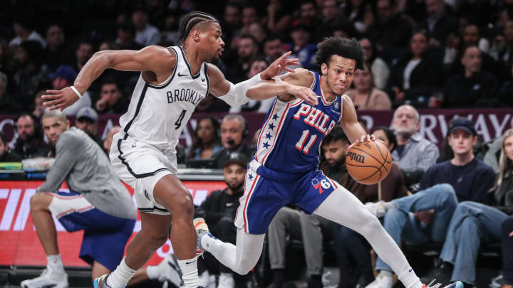 Mar 5, 2024; Brooklyn, New York, USA; Philadelphia 76ers guard Jeff Dowtin Jr. (11) drives past Brooklyn Nets guard Dennis Smith Jr. (4) in the second quarter at Barclays Center. Mandatory Credit: Wendell Cruz-USA TODAY Sports Mar 5, 2024; Brooklyn, New York, USA; Philadelphia 76ers guard Jeff Dowtin Jr. (11) drives past Brooklyn Nets guard Dennis Smith Jr. (4) in the second quarter at Barclays Center. Mandatory Credit: Wendell Cruz-USA TODAY Sports