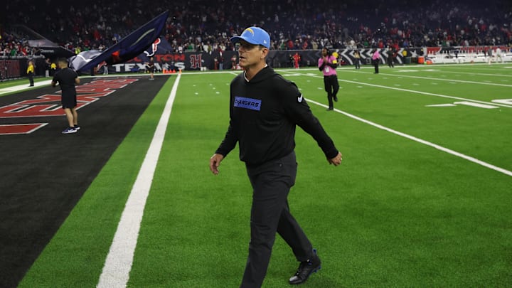 Jan 11, 2025; Houston, Texas, USA; Los Angeles Chargers head coach Jim Harbaugh walks off after losing to Houston Texans in an AFC wild card game at NRG Stadium. Mandatory Credit: Thomas Shea-Imagn Images Jan 11, 2025; Houston, Texas, USA; Los Angeles Chargers head coach Jim Harbaugh walks off after losing to Houston Texans in an AFC wild card game at NRG Stadium. Mandatory Credit: Thomas Shea-Imagn Images