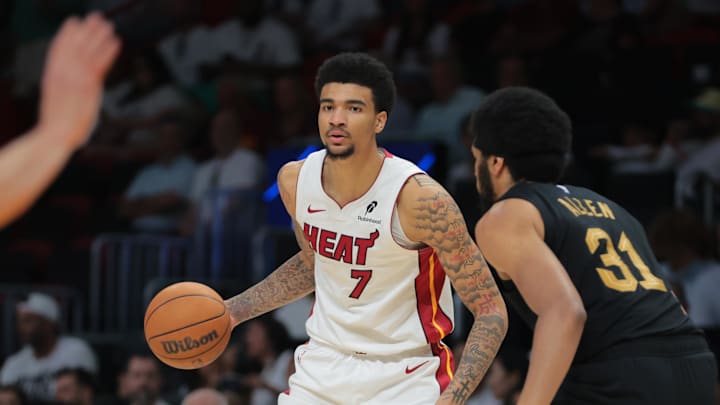 Apr 26, 2025; Miami, Florida, USA; Miami Heat center Kel'el Ware (7) dribbles the basketball as Cleveland Cavaliers center Jarrett Allen (31) defends in the third quarter during game three for the first round of the 2025 NBA Playoffs at Kaseya Center. Mandatory Credit: Sam Navarro-Imagn Images